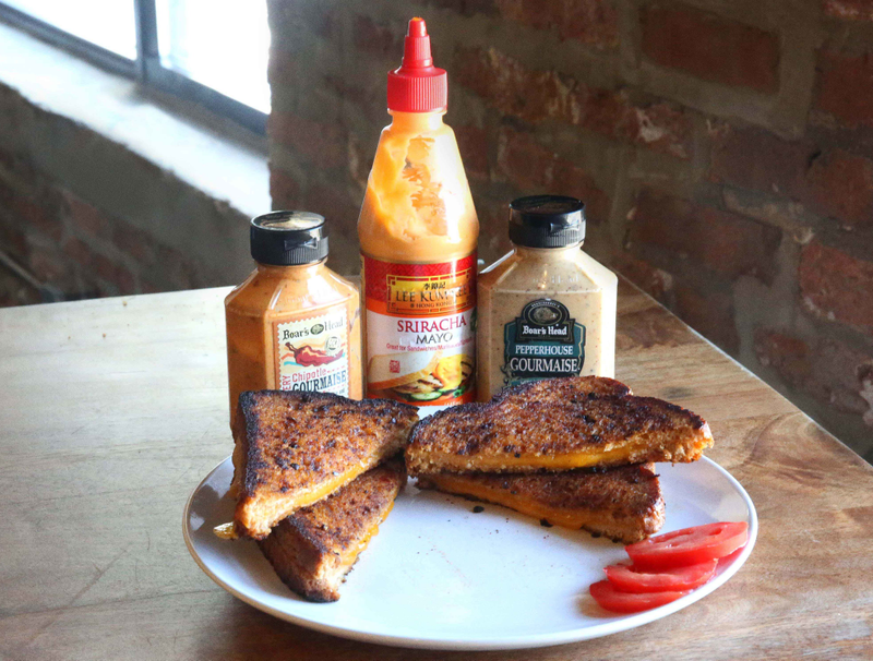 Illustration for article titled Slather grilled cheese exteriors with flavored mayo